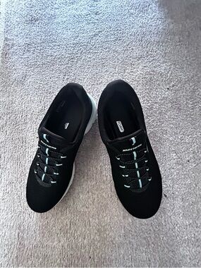 Skechers Women’s Black Slip-On Athletic Sneakers with Light Teal Accents